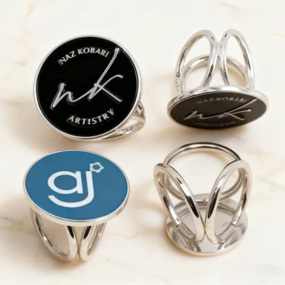 A fashionable silver metal tri-ring buckle for silk scarves or T-shirts, with an exquisite custom brand Logo decorated on the center ring