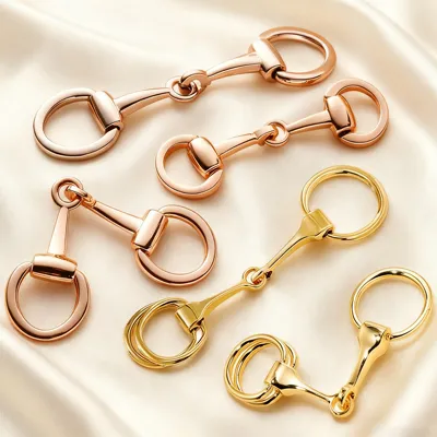 A high-polished horsebit scarf clip