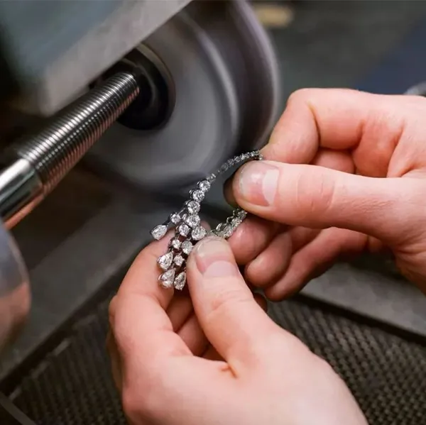 A smooth and shiny metal surface after manual polishing.