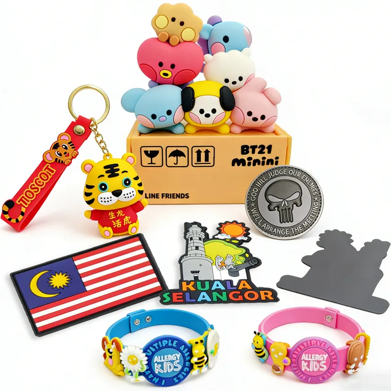 Custom soft PVC promotional products including keychains and fridge magnets