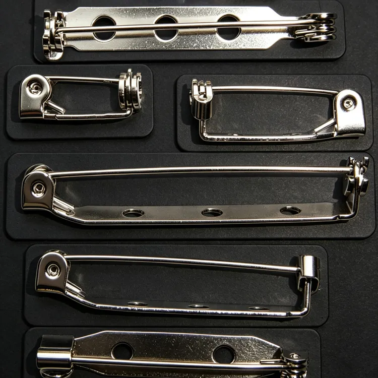 Metal safety pin style backing for lapel pins and badges with easy attachment