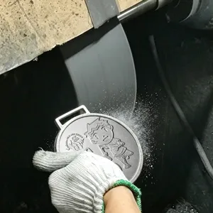 Custom medal polishing process for smooth metal finish